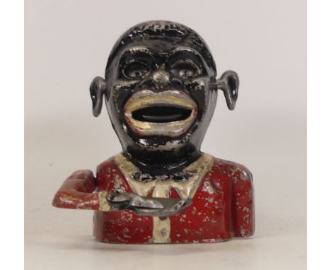 A Jolly Fellow Money Bank Painted on White Metal Base Notice from the the-saleroom.com: These items are listed on the basis t