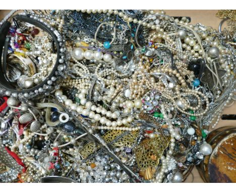 A large quantity of unsorted vintage costume jewellery 