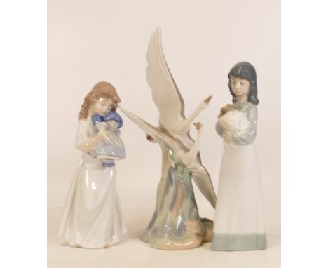 Three Nao Figures to include Girl Holding a Puppy, Girl with a Doll and Herons in Flight (one beak a/f) 
