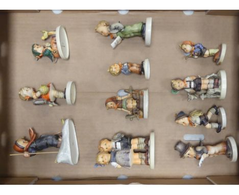 A Collection of Eleven Hummel Children Figures to include Skiing Boy, Carol Singers, Boy with Goat etc. (11) 