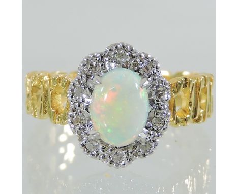 An 18 carat gold, opal and diamond ring, boxed 