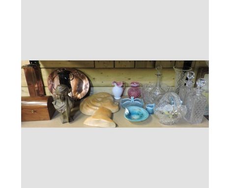 A shelf of items to include an art nouveau style copper tray, a copper vase, rosewood caddy, a deco style carving and glasswa