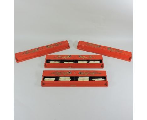 A set of four red lacquered mahjong tile boxes, 42cm, containing markers