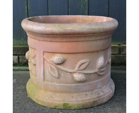 A large terracotta barrel shaped planter, 43cm tall