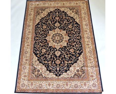 A Keshan carpet, with a central medallion, on a blue ground, 230 x 160cm