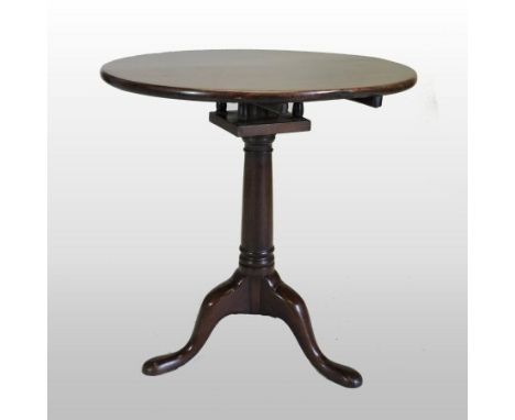 A George III mahogany circular tilt-top occasional table, with bird cage action, on a turned column and tripod base, 67cm