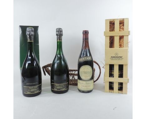 A bottle of Bertani Amarone recioto della valpolicella 1973, a bottle of champagne, produced for 'Lancaster Garages', cased, 