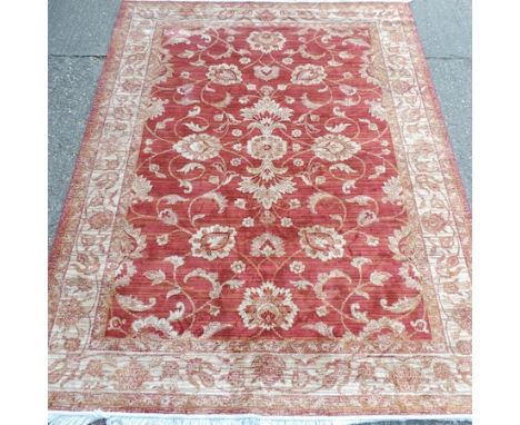 A Keshan carpet on a red ground, 290 x 200cm