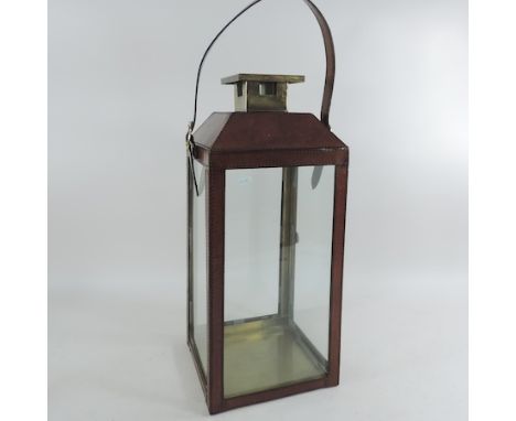 A brown leather hanging lantern, 49cm tall
