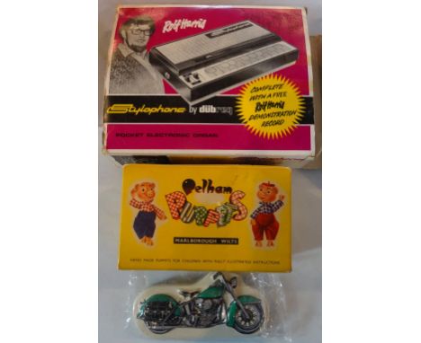 A boxed Pelham Puppet 'Foal', together with a Rolf Harris Stylophone in original packaging and a boxed Harley Davidson timepi