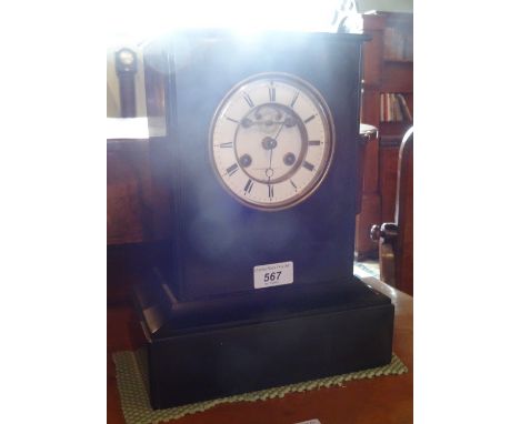 A slate mantle clock, the dial marked Litherland Davies & Co., Paris, 31cm tall.