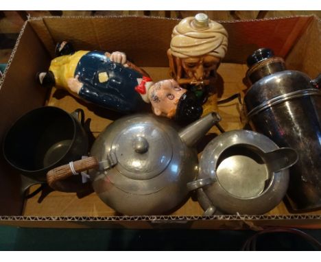 An Arts & Crafts Tudric pewter ware part-tea service, comprising: teapot, sugar bowl and milk jug, together with a pewter 're