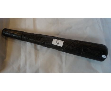 A Irish bog oak truncheon, carved with shamrock and a harp, 39cm.