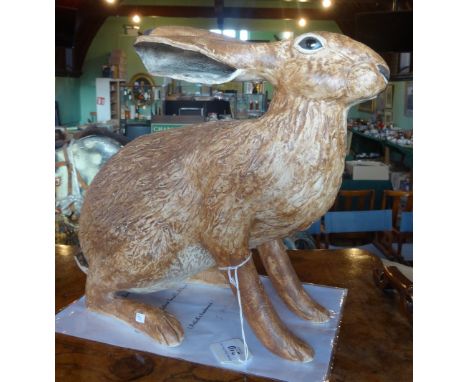 A large ceramic sculpture of a hare, 31cm tall.
