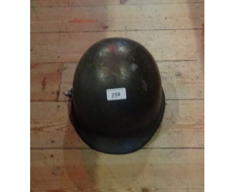 An American WWII GI helmet, having internal webbing.