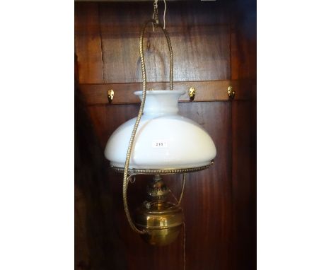 A late Victorian brass oil lamp, together with a brass ceiling hanging oil lamp with opaque fitted shade.