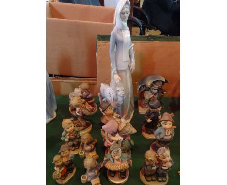 Thirteen Hummel figurines, to include: 'Not For You', 'Little Book Keeper' and 'Surprise', together with a Spanish figurine o