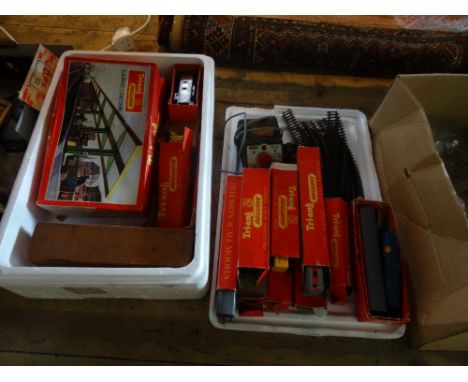 A collection of Tri-ang railway equipment, to include: two engines, a boxed R.459A large station, a quantity of boxed rolling