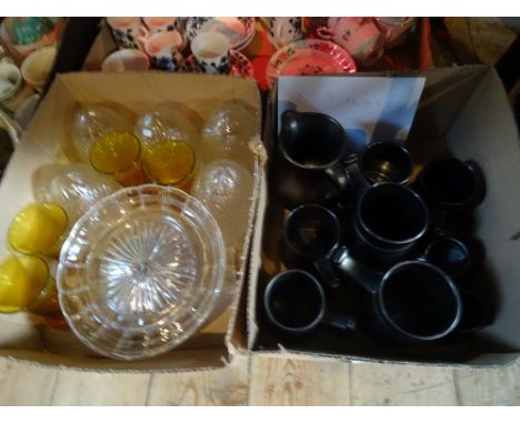 Three boxes containing assorted china and glass to include: Prinknash Abbey tankards, pineapple shaped glass lamp globes, a M