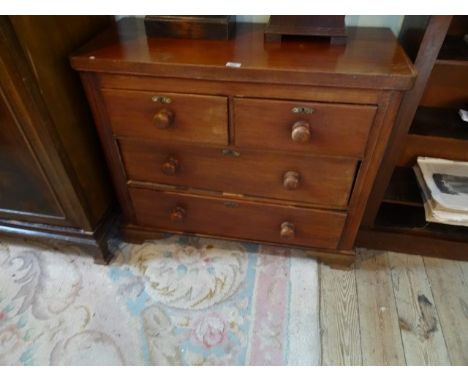 A small mahogany chest, having two short over long drawers on bracket feet, 94cm wide.
