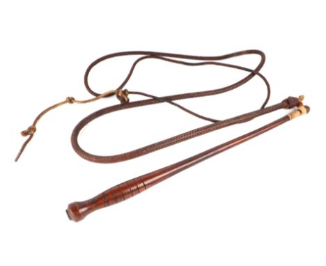 A leather bull whip with treen handle.