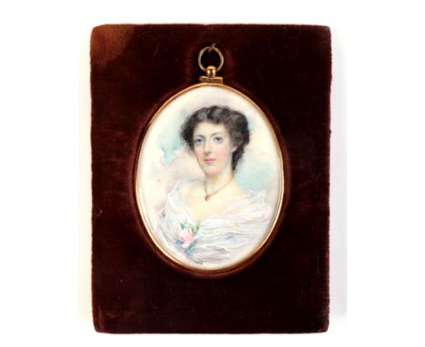 An early 20th century oval portrait miniature on ivory depicting a young lady wearing a gold necklace, signed 'J M Scottlos' 