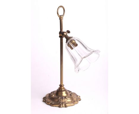 A brass student type table lamp with cut glass shade, 34cms high.