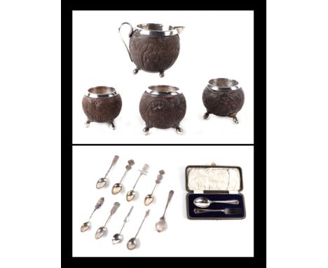 Three white metal mounted coconut cups and matching jug; together with a boxed silver fork & spoon set; and a quantity of sil