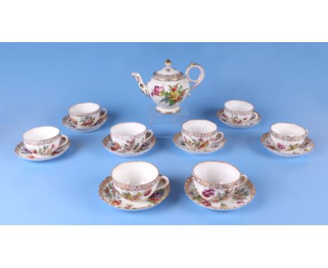Eight Dresden cups and saucers decorated with flowers, together with a similar Dresden teapot.  Condition Report The cups and