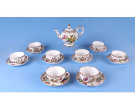 Eight Dresden cups and saucers decorated with flowers, together with a similar Dresden teapot.  Condition Report The cups and