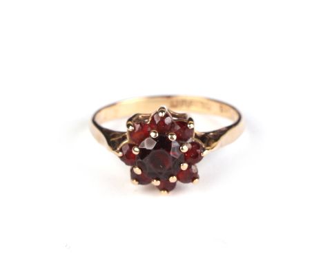 A 9ct gold garnet cluster ring, approx UK size L, 2g.