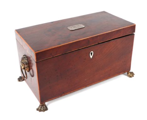 A Regency mahogany tea caddy with two internal compartments and mixing bowl, on lion paw feet, 31cms wide.