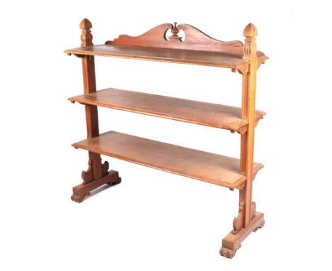 A Victorian walnut three-tier buffet with carved shaped end supports, 122cms wide.