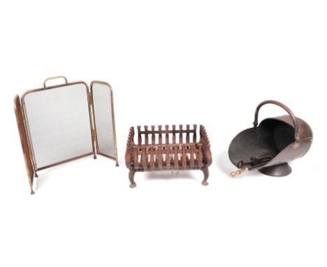 Two iron fire grates; together with a brass folding firescreen; a Victorian copper coal scuttle; and a cast iron fireback.