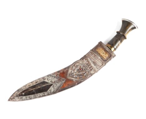 An Indian kukri with ornate white and yellow metal mounted leather scabbard and horn handle, 48cms long.