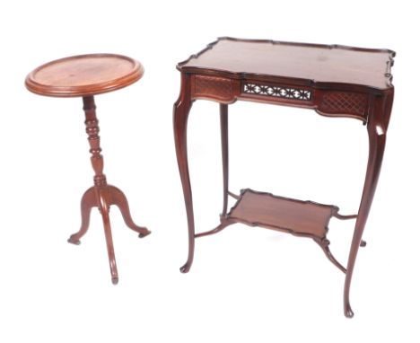 A George III style mahogany side table in the Chippendale manner, the shaped rectangular top above a pierced frieze, on taper