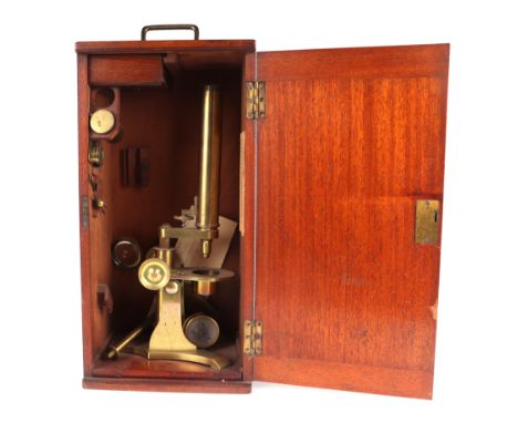 A Baker of London Victorian brass monocular microscope fitted in a mahogany case.