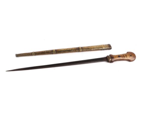 A North African / Arabic short sword with horn handle and triangular blade in a brass scabbard, overall 57cms long.