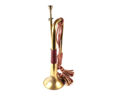 A brass military bugle, 53cms long.