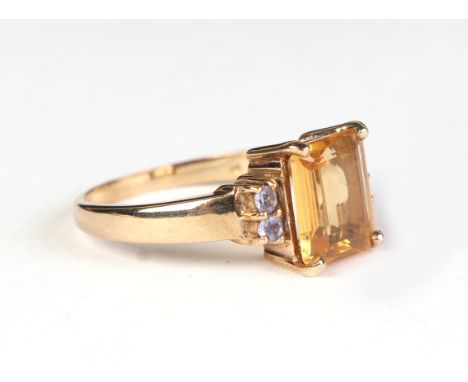 A 9ct gold dress ring set with a large pale yellow stone, approx UK size Q, 4.1g.