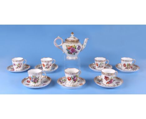 Seven Dresden cups and saucers decorated with flowers; together with a Dresden teapot. Condition Report Saucers may be associ