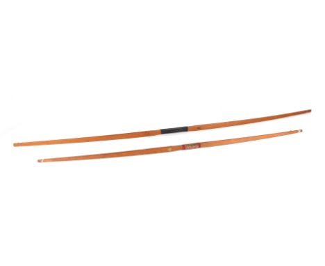 A vintage Slazenger archery bow, 152cms long; together with a K & C Ltd archery bow, 120cms long (2).