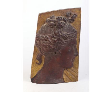 An early 20th century carved and painted profile head and shoulder portrait of a neo-classical lady, carved in high relief, 1