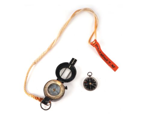 A WWII 1940 dated Mk III Marching compass by T G Co. Ltd; together with a brass pocket compass (2).