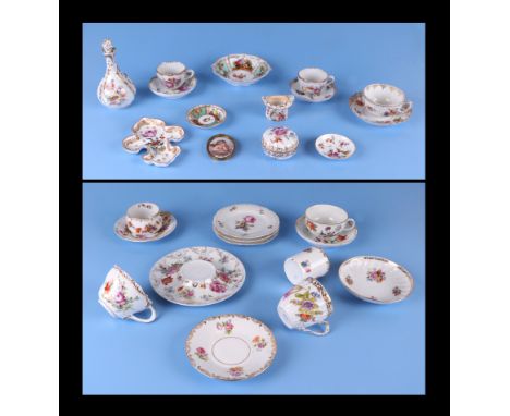 A group of continental porcelain items to include a scent bottle, a top hat match striker, an oval plaque depicting a cherub,