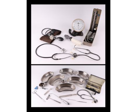 A quantity of vintage medical instruments to include a stethoscope, reflex hammers and blood pressure machine.