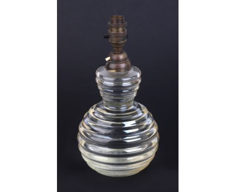 A vintage glass table lamp, 28cms high.Condition ReportThe cable goes into the brass fitting and the lamp itself is not drill