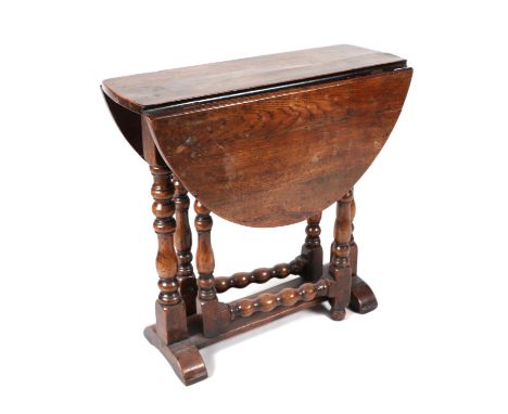 A George III style mahogany carver chair; together with another similar, an onyx standard lamp, a drop-leaf table and other o