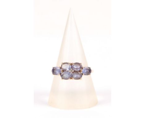 A 14ct gold ring set with six pale purple stones, approx UK size N, 2.8g.Condition ReportIn good condition.