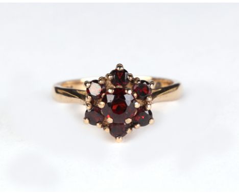 A 9ct gold garnet cluster ring, approx UK size M, 3.4g.